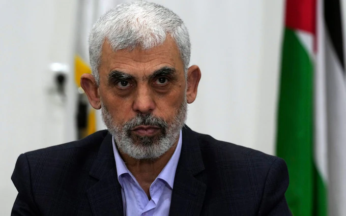 Yahya Sinwar, head of Hamas in Gaza, chairing a meeting with leaders of Palestinian factions at his office in Gaza City in 2022 Credit: Adel Hana/AP